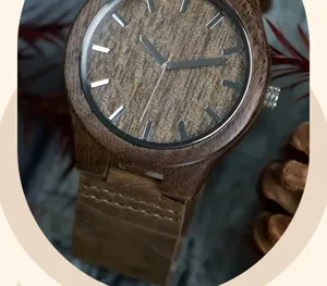 Minimalist men's wooden quartz watch featuring a natural walnut case and comfortable brown strap.