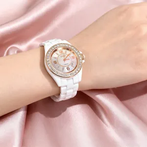 Elegant white ceramic quartz watch for women with sparkling crystal bezel and date display.
