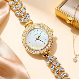 Elegant women gold quartz watch featuring sparkling crystal leaf bracelet and mother-of-pearl dial.