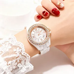 Elegant women quartz watch with white ceramic strap and rhinestone bezel on wrist main view