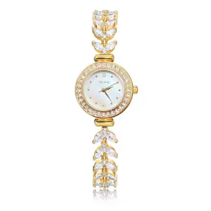 Elegant gold rhinestone women quartz watch with creative crystal leaf bracelet design.