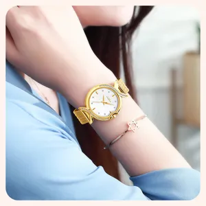 Women's gold quartz watch with mother of pearl dial, rhinestone fishtail design and mesh strap.