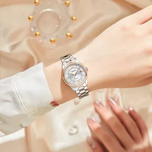 Elegant women quartz watch with two-tone stainless steel strap and clear calendar display.