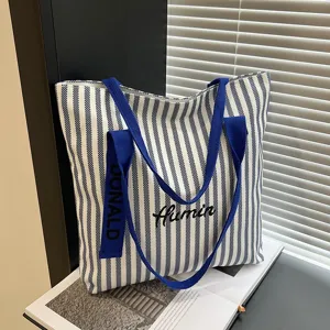 Striped canvas tote bag for women, large capacity casual shoulder bag and commuter handbag.