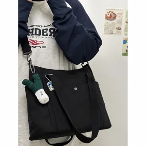 Women large capacity canvas tote bag casual shoulder crossbody bag for daily work commuting.