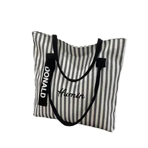 Black and white striped canvas tote bag for women, large capacity casual shoulder bag.