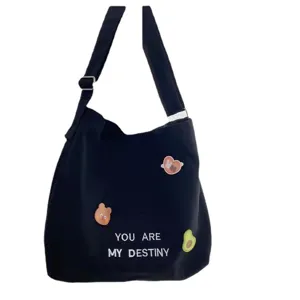 Black canvas tote bag large capacity casual shoulder crossbody bag for women with cute patches.