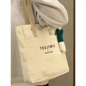 Casual canvas tote bag for women, large capacity shoulder bag for daily commuting and student use.