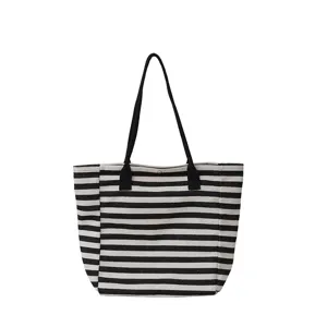 Classic black and white striped canvas tote bag, large capacity daily commuter shoulder bag.