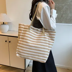 Women large capacity striped canvas tote bag, casual commuter shoulder handbag for daily use.