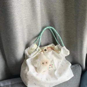 Cute cartoon rabbit canvas tote bag large capacity daily commuter handbag with plush star charm.
