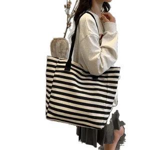 Classic black and white striped canvas tote bag for women, large capacity commuter shoulder bag.