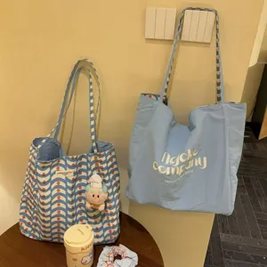 Large capacity casual canvas tote bag, stylish double-sided shoulder bag for daily commute.