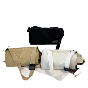 Corduroy cylinder shoulder bag, casual pillow crossbody bag with large capacity, minimalist style.