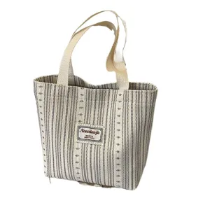 Black and white striped canvas tote bag for women, casual handbag and shoulder commuting bag.