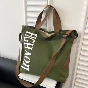 Sac cabas en toile verte décontracté avec lanières marron et grande capacité de rangement.