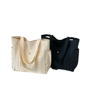 Large capacity canvas tote bag for women, casual commuter shoulder bag with multi-pockets.
