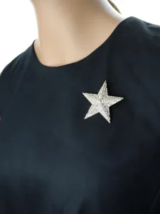Vintage crystal star brooch pin for women and men, sparkling rhinestone suit dress accessory.