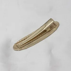 Gold vintage palace embossed hair clip detail shot, elegant side hairpin accessory for women.