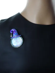 Vintage moon face witch hat brooch crystal magical pendant accessory detail shot for women.