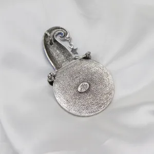 Detailed view of the vintage silver magical moon brooch and pendant back with hallmark.