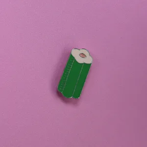 Cute green sleeping bag enamel pin detail, green metal brooch close-up for accessories.