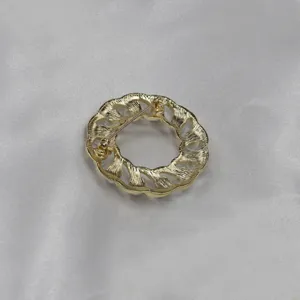 Vintage gold tone hollow chain pearl brooch detail shot showing back pin structure clearly.