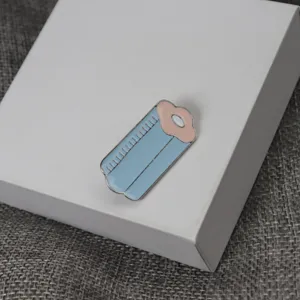 Detailed shot of creative enamel brooch with blue and pink design, exquisite accessory.