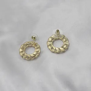 Elegant gold-colored hollow circular stud earrings featuring textured design for daily women wear.
