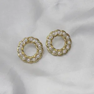 Detail view of vintage gold hollow chain pearl hoop earrings, elegant and classic style.