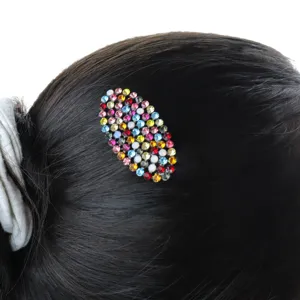 Crystal rhinestone hair clip detail shot showing sparkling colorful stones on hair.