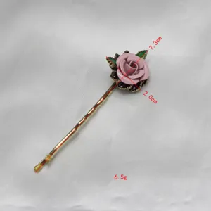 Vintage enamel rose hair clip detail shot showing dimensions and exquisite floral craftsmanship.