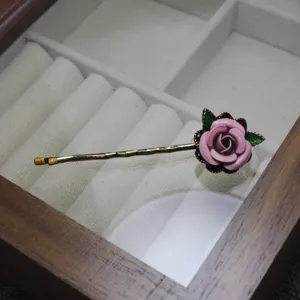 Vintage enamel rose hair clip for women, elegant pink floral bobby pin hair accessory.