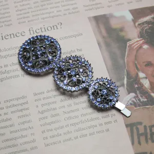Korean style rhinestone hollow round hair clip detail shot, elegant blue crystal metal barrette.