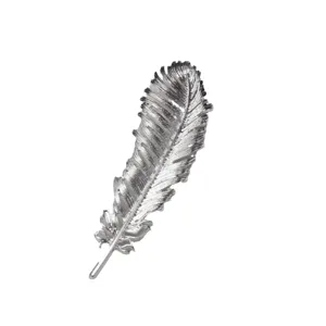 Silver feather brooch pin for women, elegant metallic lapel accessory for suits and dresses.