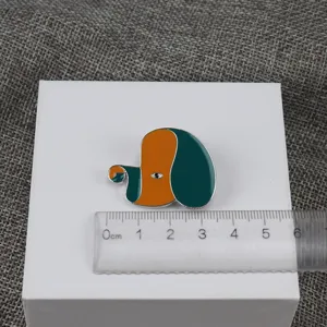 Unique animal enamel brooch featuring stylish orange and green color contrast design metal.