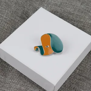 Designer enamel dog brooch pin abstract orange green fashion clothing accessory detail view