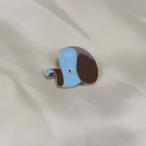 Close-up detail shot of the quirky abstract animal enamel brooch, showing fine glaze texture.