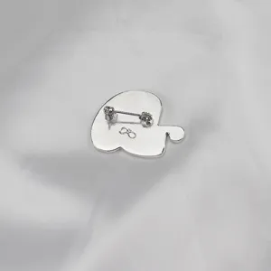 Back detail view of the silver-plated animal enamel brooch showing secure pin mechanism.