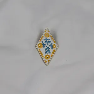 Elegant diamond enamel brooch featuring a chic floral pattern, perfect clothing accessory.