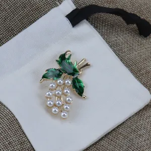 Vintage green enamel leaf and faux pearl grape brooch detail view for women clothing accessories.