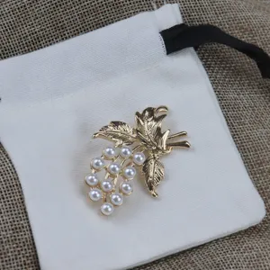Detailed view of the gold grape leaf pearl brooch, showcasing exquisite vintage design.