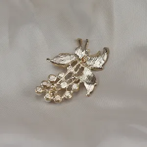 Detailed back view of the vintage pearl grape brooch, showing the pin structure clearly.