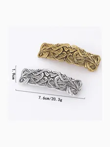 Vintage alloy hair clip with intricate engraved patterns, elegant retro style hair accessory.
