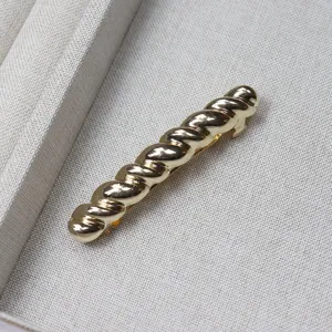 Gold twisted metal hair clip small spring barrette elegant hair accessory for women styling