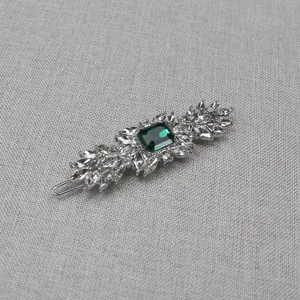 Vintage crystal hair clip with emerald green center stone elegant hair barrette accessory.