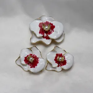 Vintage enamel pearl orchid flower brooch and earrings set fine detail showcase.