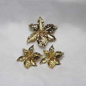 Elegant gold metallic iris flower brooch and earrings set, chic minimalist style jewelry.
