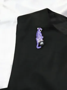 Stunning crystal blue panther brooch with a dark pearl. Elegant pin for jackets, suits.