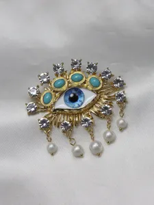 Exquisite evil eye brooch detail, gold tone alloy with blue crystal and hanging pearls.